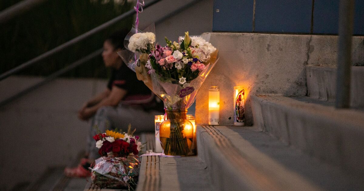 1187974 students place flowers candles at helen bernstein high school cull jja 0003