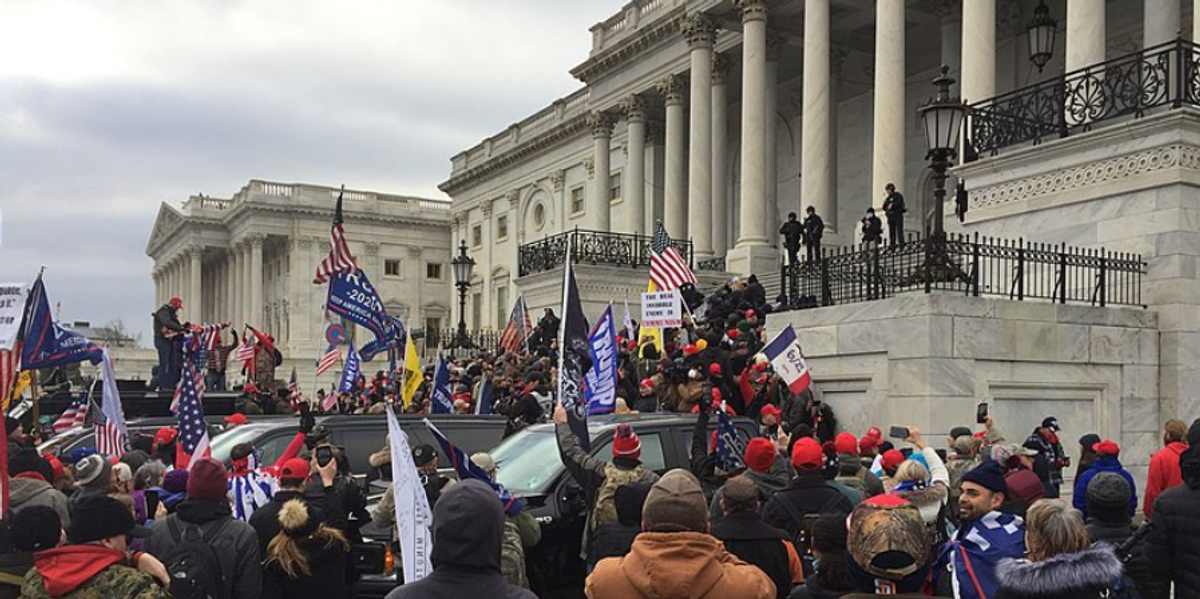 crowd of trump supporters marching on the us capitol on 6 january 2021 ultimately leading the building being breached and sever